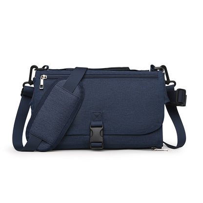 Blue messenger bag with a strap on a white background