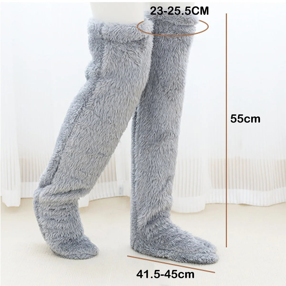 Gray fuzzy leg warmers with measurements on a white background