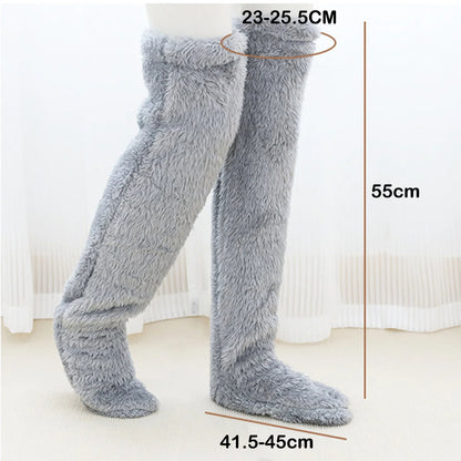 Gray fuzzy leg warmers with measurements on a white background
