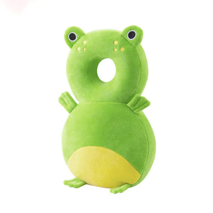 Green frog-shaped pillow on a white background