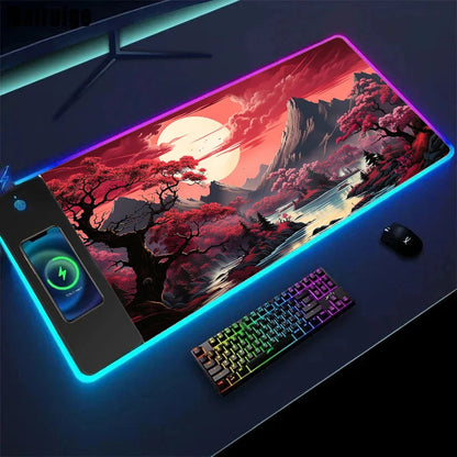 Gaming setup with a large mouse pad featuring a scenic design, keyboard, and mouse on a dark surface.