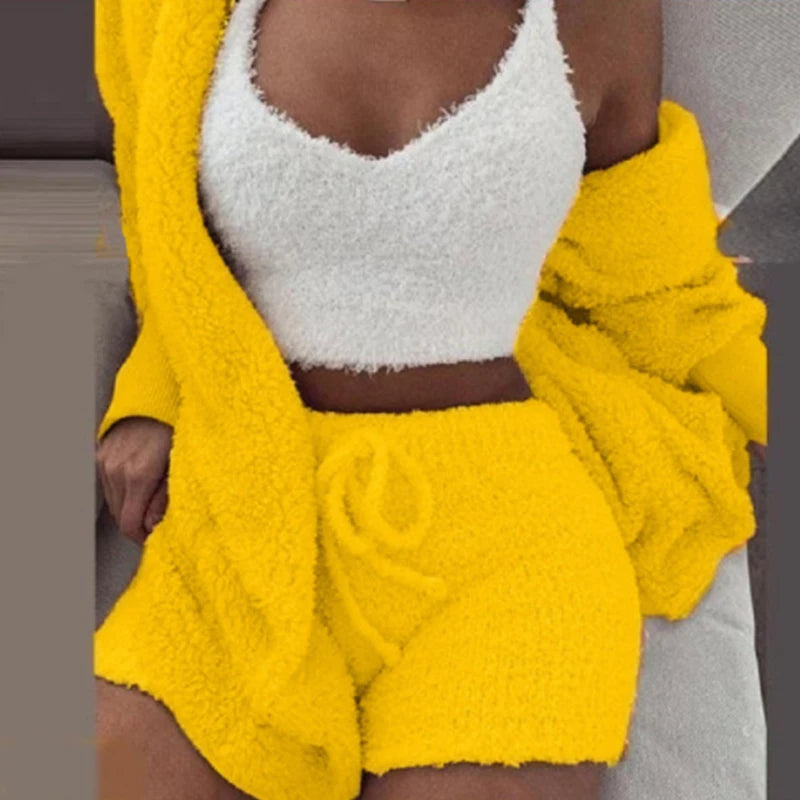 Person wearing a yellow fleece outfit with a white top.