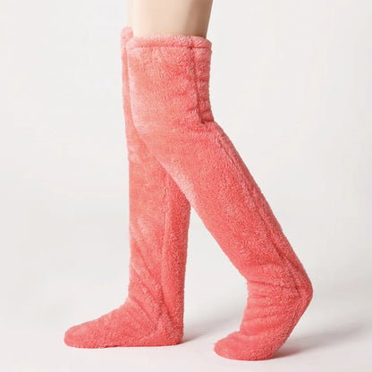Pink fuzzy socks on a white background
