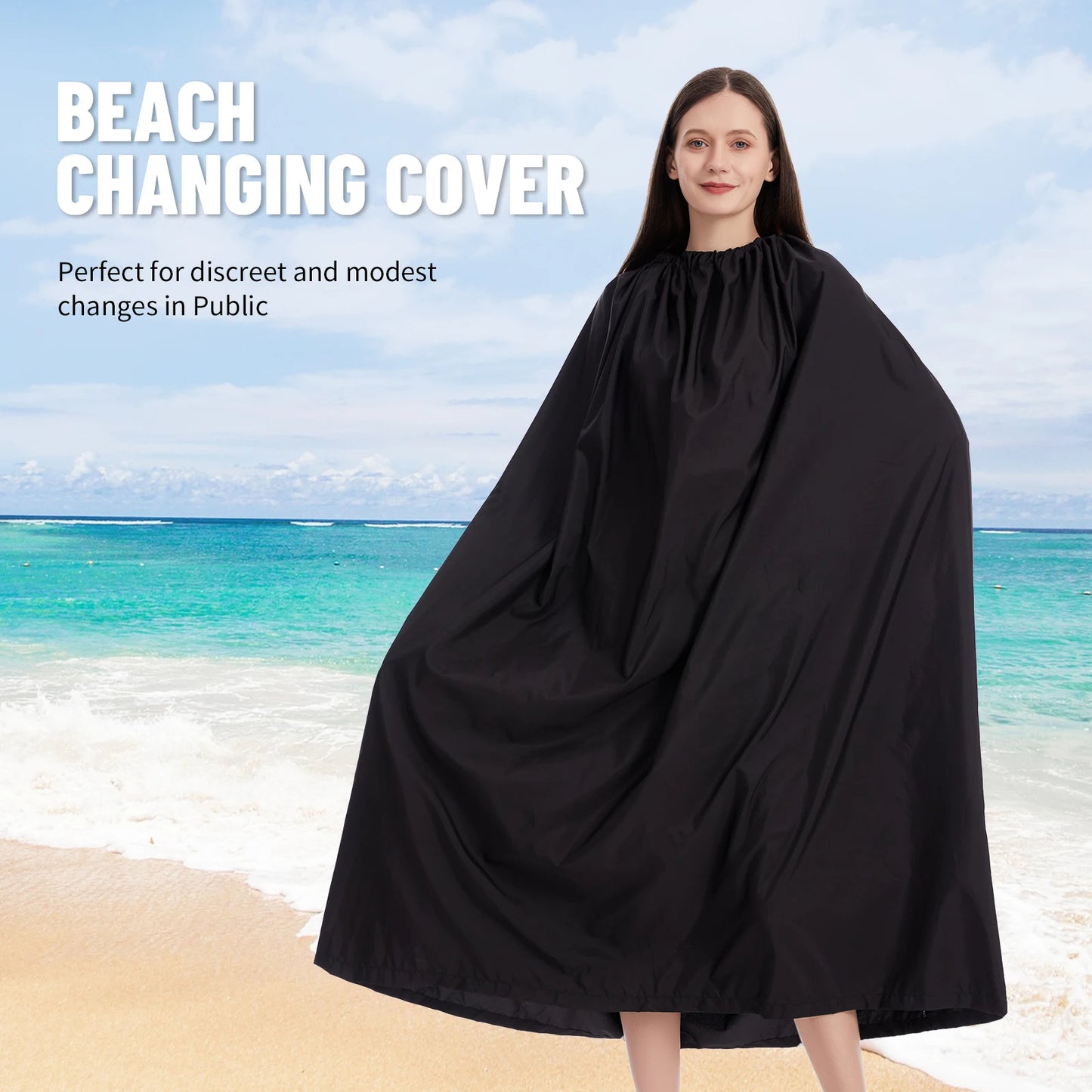 Woman wearing a black beach changing cover on a beach with ocean view