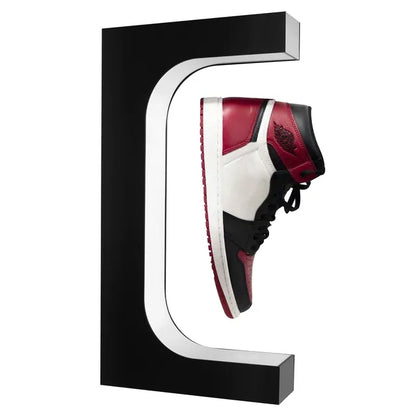 Magnetic levitation floating shoe display stand with LED lights showcasing sneaker in mid-air