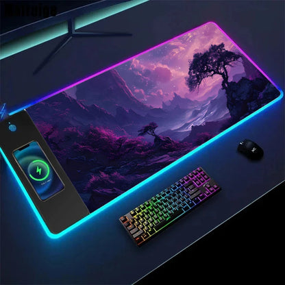 Gaming setup with a large mouse pad featuring a scenic design, keyboard, and phone on a dark surface.