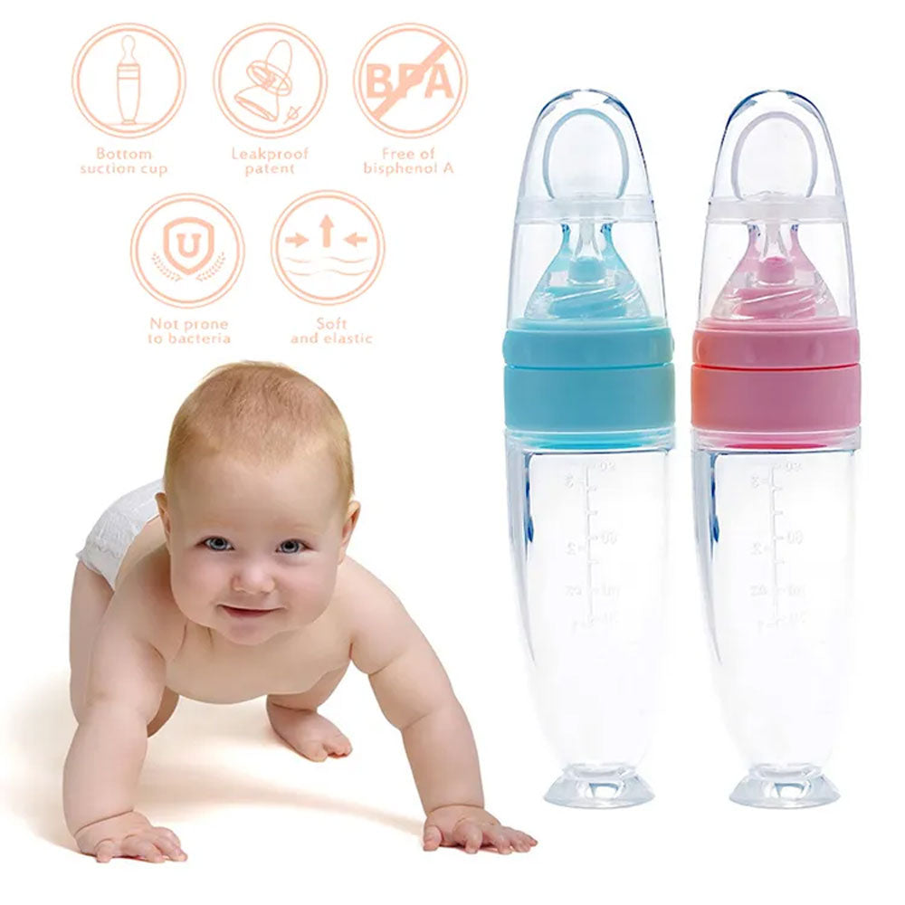 Two baby bottles with colorful caps next to a crawling baby on a white background.