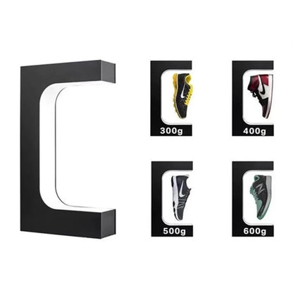 Close-up of sneaker hovering on magnetic levitation display stand with glowing LED base