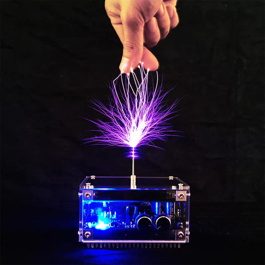 Electrostatic generator with purple sparks and clear base on a black background
