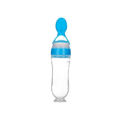 Clear baby bottle with blue accents on a white background