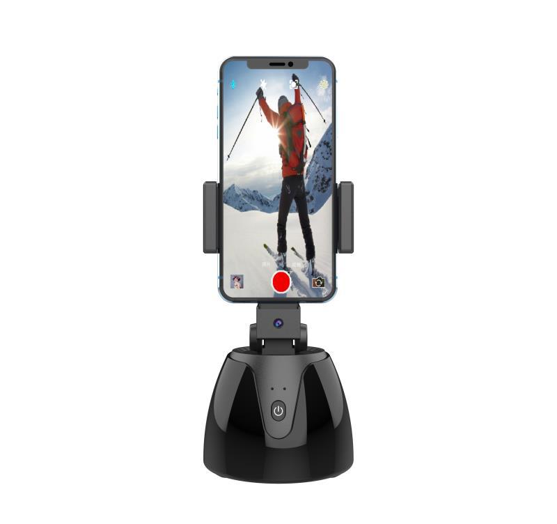 Phone holder with smartphone displaying a skiing app on a white background