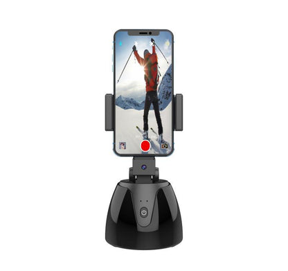 Phone holder with smartphone displaying a skiing app on a white background