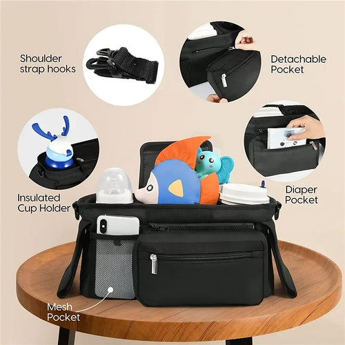 Black diaper bag with various compartments and features highlighted on a beige background