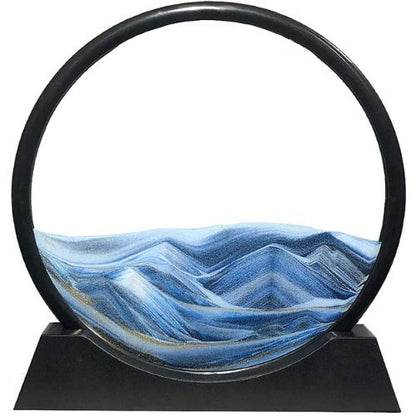 Glass sculpture of a mountain landscape with a black metal frame on a white background