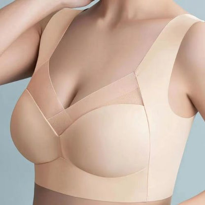 Beige bra worn by a model on a light gray background