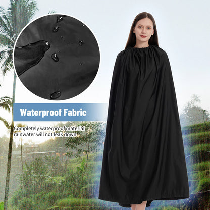 Woman wearing a black waterproof cape with raindrop illustration and text on a blurred outdoor background.