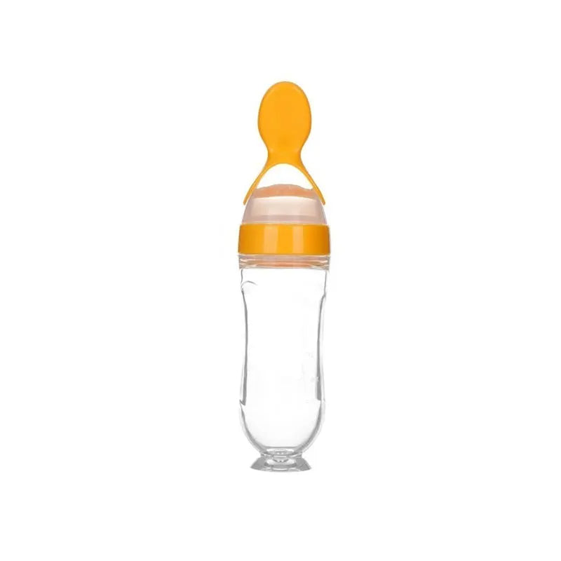 Clear bottle with orange lid and spoon on a white background