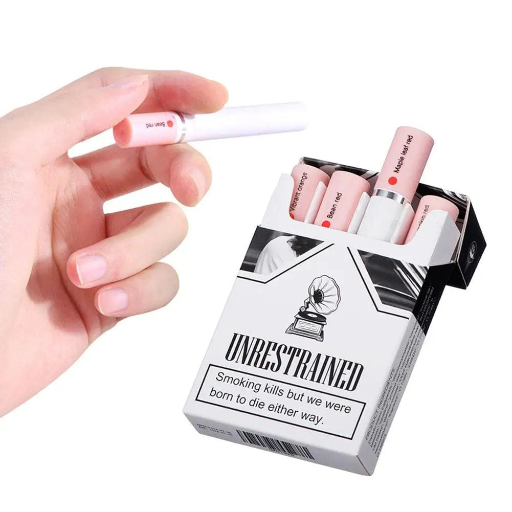 Hand holding a pink electronic cigarette next to an 'Unrestrained' product box.