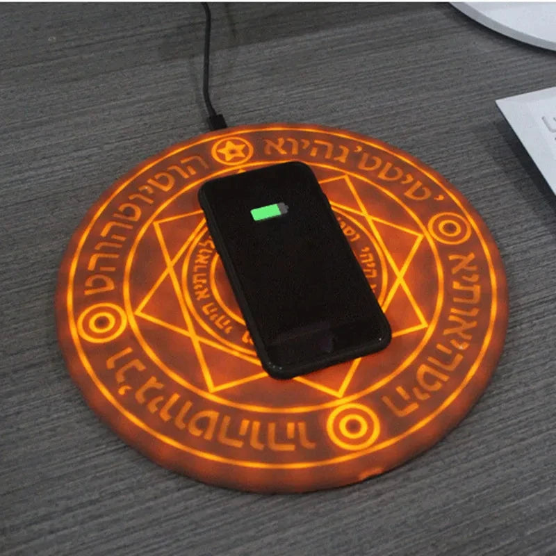 Wireless charging pad with a phone on a dark surface