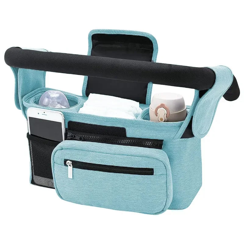Teal car seat organizer with black handle and compartments on a white background