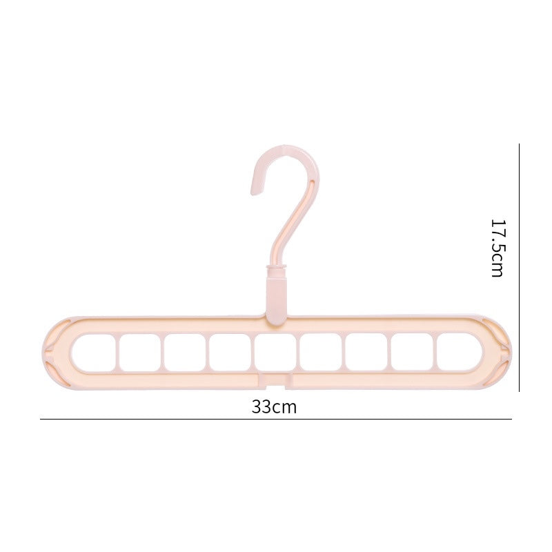 Pink multi-clip hanger with measurements on a white background