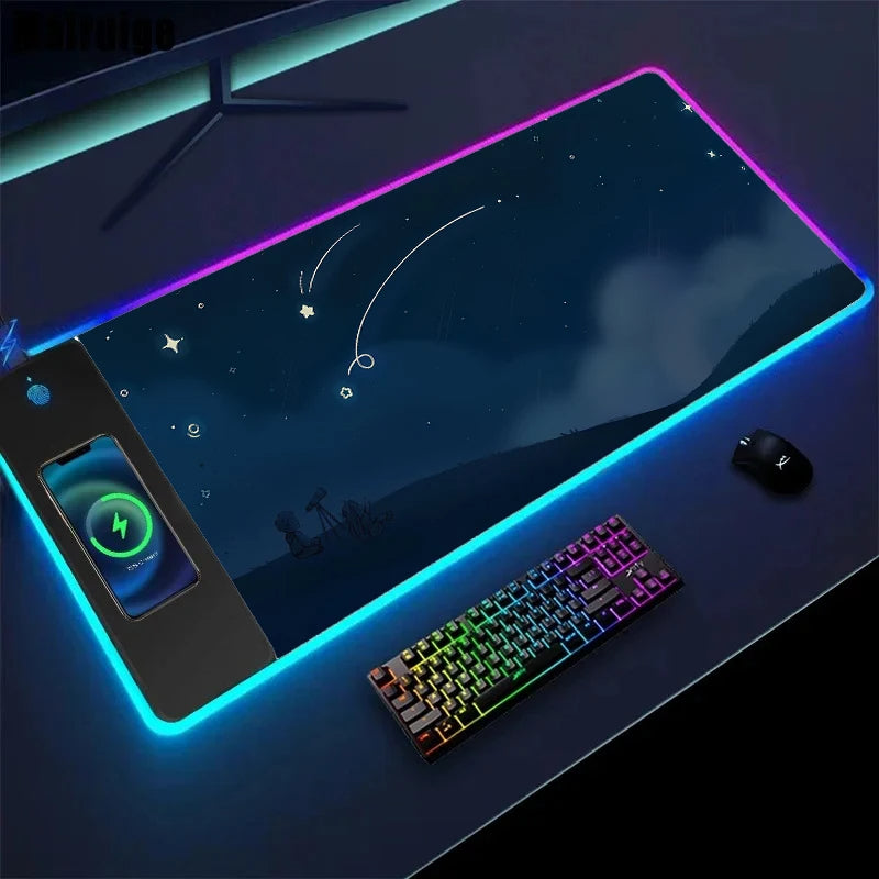 Gaming desk setup with large mouse pad, keyboard, and phone on a dark surface.