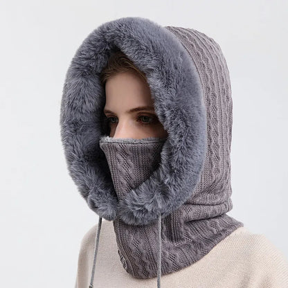 Gray knitted cowl with fur trim worn by a mannequin on a light gray background