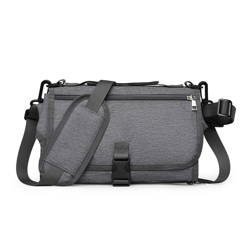 Gray shoulder bag with multiple compartments on a white background